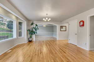 Semi Dining area looking toward formal dining room with bay box window