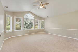 Large master Bedroom with vaulted ceiling, brand new carpet, bay window, view and ceiling fan