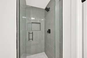 Bathroom featuring walk in shower