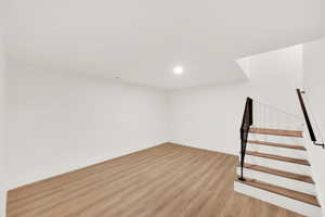 Basement featuring light hardwood / wood-style flooring