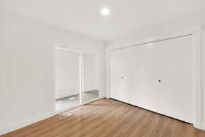 Unfurnished bedroom with light hardwood / wood-style floors