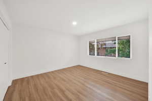 Spare room with light wood-type flooring