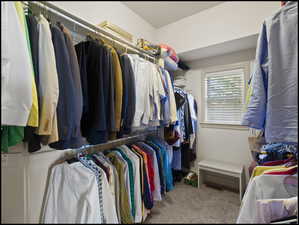 Primary bedroom walk-in closet