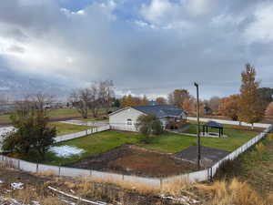 Exterior space featuring a yard and a mountain view