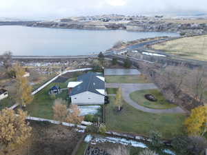 Birds eye view of property featuring a water view