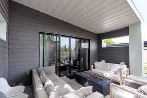 Interior space featuring wooden walls, wood ceiling, and vaulted ceiling