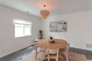 Dining space featuring an inviting chandelier