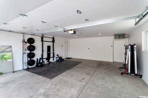 Garage featuring a garage door opener