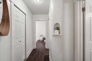 Hallway leading to bedrooms and full bathroom, main floor