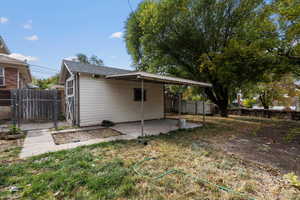 Back of house with a patio