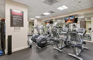 Workout area with a paneled ceiling