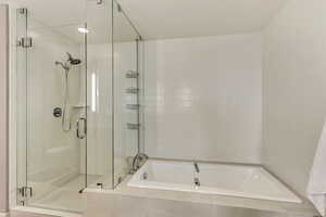 Bathroom featuring plus walk in shower