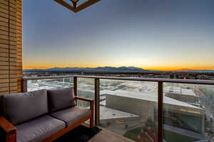 Snow covered back of property featuring a mountain view