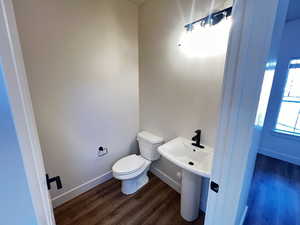 Bathroom featuring toilet and hardwood / wood-style floors