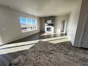 Living room with dark wood-type flooring