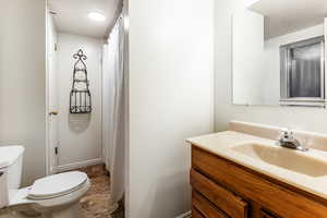 Bathroom featuring toilet and vanity