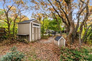 View of yard with a storage unit