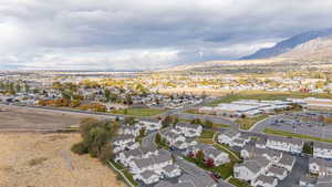 Birds eye view of property with a mountain view