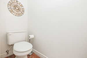 Bathroom featuring tile patterned flooring and toilet