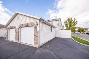 View of property exterior featuring a garage