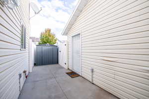 Exterior space with a patio area and a storage shed