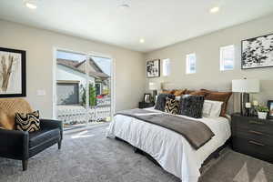 Bedroom featuring access to outside and carpet