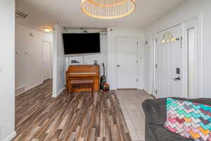 Foyer featuring dark wood-type flooring, and tile