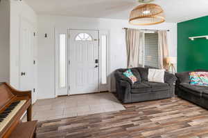 Entryway with hardwood / wood-style floors