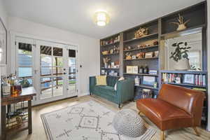 Sitting Area with Wood Floors and Bookshelves