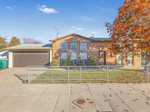 View of front facade with a garage and a front yard