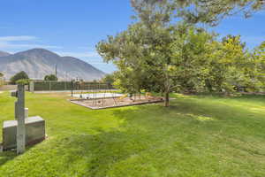 View of yard featuring a mountain view and a playground