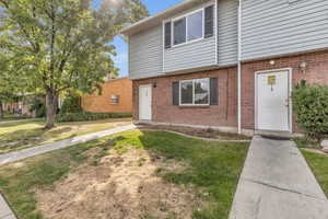 View of front of property with a front lawn