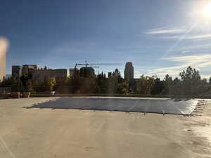 South facing View of swimming pool overlooking terraced landscaping