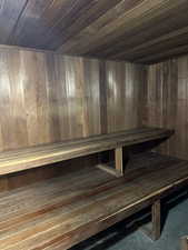 View of sauna / steam room featuring wooden walls and wooden ceiling