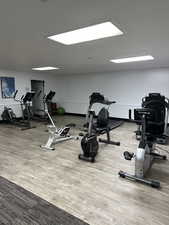 Workout room featuring hardwood / wood-style floors