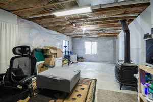 Basement featuring a wood stove