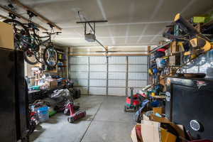 Garage featuring a garage door opener