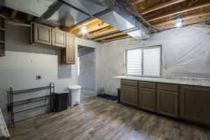 Basement with dark wood-type flooring