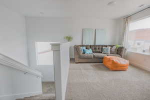 Living room with light colored carpet