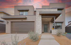 View of front of home featuring a garage