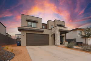 View of front facade featuring a garage