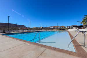 View of pool with a mountain view