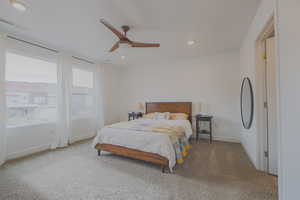 Carpeted bedroom with ceiling fan