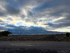 Property view of mountains with a rural view