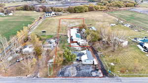 Birds eye view of property featuring a rural view