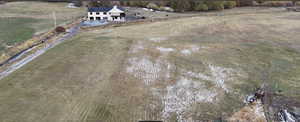 Birds eye view of property with a rural view