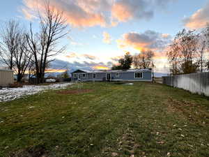 View of yard at dusk