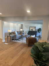 Living room with light hardwood / wood-style flooring