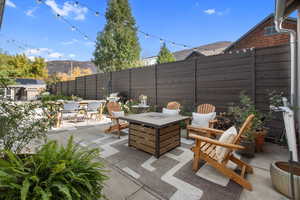 View of patio / terrace with a mountain view and an outdoor fire pit