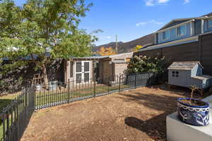 View of yard with a storage shed and a mountain view